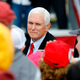 US Vice President Mike Pence greets supporters after his “Make America Great Again!” campaign event at Oakland County International Airport in Waterford, Michigan, on October 22, 2020.